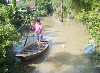 Area residents have been chipping in money and supplies to help flood victims throughout the kingdom where, in many areas like this one in Ayutthaya, the only way to get around is by boat.
