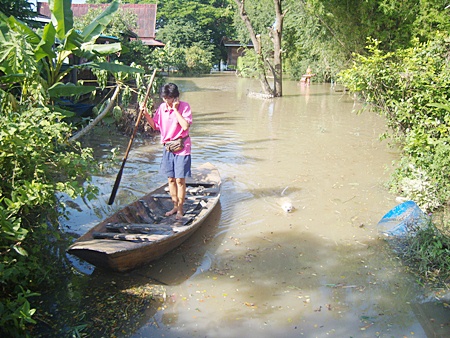 Area residents have been chipping in money and supplies to help flood victims throughout the kingdom where, in many areas like this one in Ayutthaya, the only way to get around is by boat. 