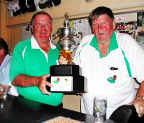 The Beaver team captains, Larry and Dennis Willett, pose with the annual challenge trophy. 
