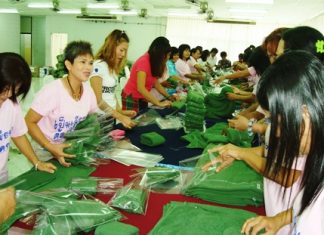 Royal Thai Marines’ wives wrap presents for their husbands stationed in the South.