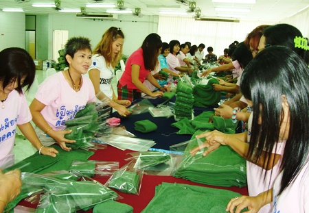 Royal Thai Marines’ wives wrap presents for their husbands stationed in the South. 