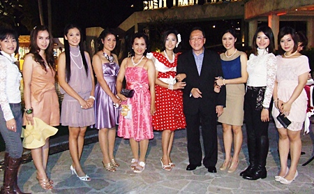 General Manager Chatchawal Supachayanont with guests at the Dusit Thani’s 1960s-theme open house party.