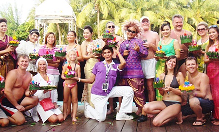 Staff and guests gather by the pool to loy their krathongs at the Hard Rock Hotel.