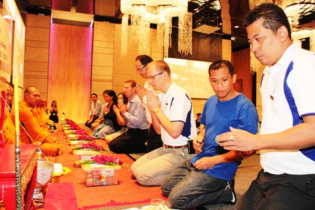 Harald Feurstein, general manager of Hilton Pattaya, led staff in performing a Buddhist merit-making ceremony with nine monks blessing the hotel and its staff.