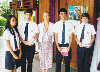 Students and a staff member from The Regent’s School, Pattaya, at St Niklaus Church 11/11/10. (L to R) Francis Calalang, Max Kirschner, Mrs Sarah Travis-Mulford, Daniel Bowler and Ethan Northcutt.