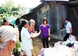 Trisha in year 9 gives rice to smiling grandma.