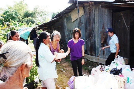 Trisha in year 9 gives rice to smiling grandma.