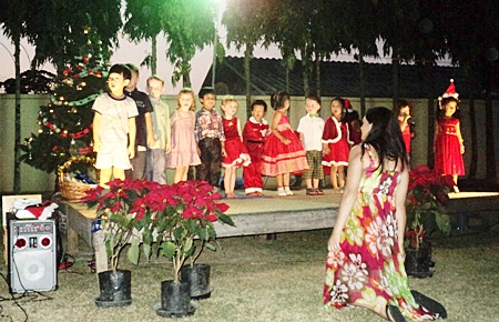 The youngsters perform a Christmas Carol for their excited parents.