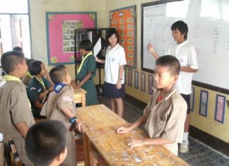 Two students from ISE explain a game.