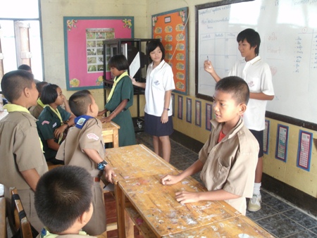 Two students from ISE explain a game.