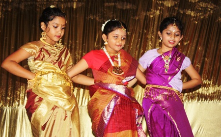 Primary students Hemakshi Prabhu, Shilpi Dhar and Sonal Rao show movements on Indian classical dance.