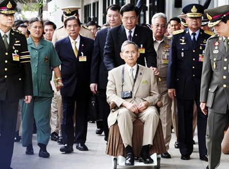 HM King Bhumibol Adulyadej is wheeled towards his yacht in a rare public appearance Wednesday Nov. 24, 2010 to open a new flood gate and two bridges in Bangkok. (AP Photo)