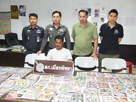 Pattaya Police Superintendent Nanthawut Suwanla-Ong (standing, center) has announced an aggressive crackdown on child pornography, which began with the arrest of Udon Dan-Ud. 