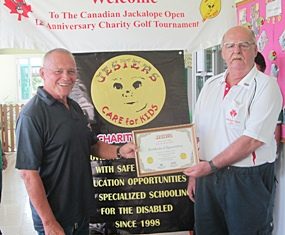 Bill Freeman presents Wayne Ogonoski with a certificate of appreciation for their Diamond Sponsorship donation this past year.