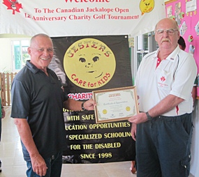 Bill Freeman presents Wayne Ogonoski with a certificate of appreciation for their Diamond Sponsorship donation this past year.