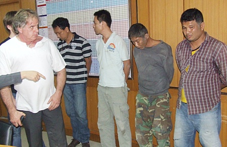 Svein Tore Holtekjolen (left) stares down the failed kidnappers.