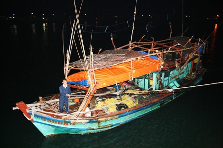 The Royal Thai Navy brings in a Vietnamese fishing boat caught illegally trawling near Sattahip. 