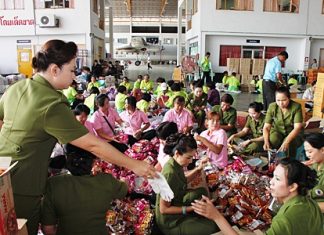 Volunteers help pack bags of relief supplies to send to flood stricken areas throughout Thailand.