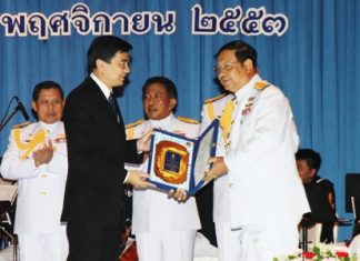 Prime Minister Abhisit Vejjajiva (left) awards Vice Adm. Sommai Prakansamut (right), director-general of the Naval Education Department and one of the many the PM inducted into the Royal Thai Navy’s “hall of fame” for service above and beyond the call of duty.