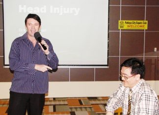 PCEC member Gavin Waddell, also international marketing executive for Phyathai Sriracha Hospital, introduces the guest speaker Dr. Wirote Jiamsiri, M.D., a neurosurgeon from the hospital, to talk about head injuries.
