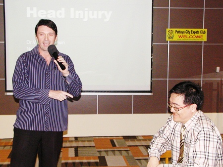 PCEC member Gavin Waddell, also international marketing executive for Phyathai Sriracha Hospital, introduces the guest speaker Dr. Wirote Jiamsiri, M.D., a neurosurgeon from the hospital, to talk about head injuries.