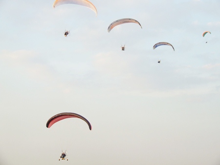 Paramotors from Thailand descend back to terra firma.