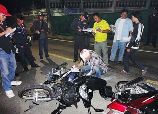 German Quarz Gunter retrieves paperwork from his demolished motorcycle after the fatal crash.