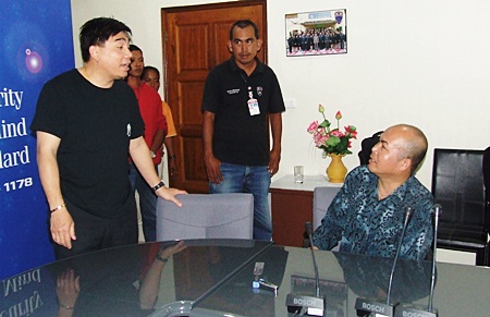 Prayong Nuanchawee (seated) has been charged with human trafficking of minors, managing a den of prostitution, child abuse, allowing minors into a venue where alcohol is served and employing underage workers.