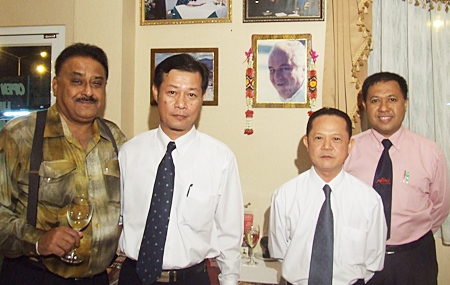 (L to R) Peter proposes a toast as Veerapong, Vichai and Paiboon, the faithful trio stand before photographs of their mentors Louis and Bruno. A glass of Louis’ favourite wine was placed in front of his portrait.