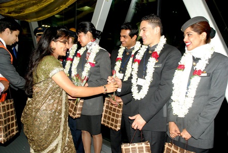 Etihad Airways cabin crew operating Etihad’s inaugural flight from Abu Dhabi to Bangalore being welcomed by airport authorities at Bengaluru International Airport on January 2, 2011.
