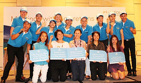 Winners of the lucky draw celebrate their winnings with Hilton Pattaya management and staff.