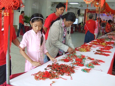 People of Thai-Chinese heritage purchase items for good luck.