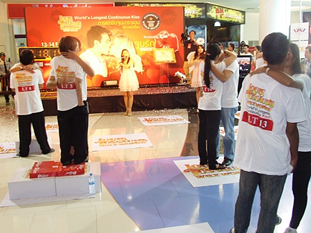The kissing couple attempt to smooch their way into the record books at the Royal Garden Plaza in Pattaya, Feb. 14.