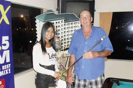 Tuesday’s A Flight winner Alan Griffiths, right, receives his prize.