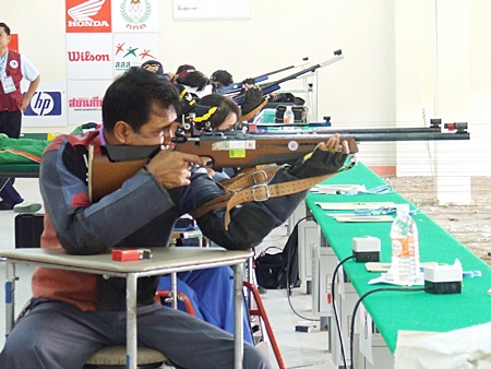 Competitors take part in the shooting event.