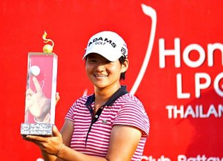 Yani Tseng of Taiwan holds up the 2011 Honda LPGA Thailand champion’s trophy after shooting a final round 66 to win the tournament by 5 shots on Sunday, Feb. 20.