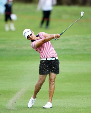 Tseng strikes an iron into the green during her final round.