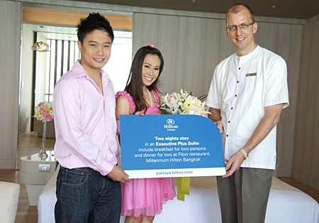 Harald Feurstein (right), general manager of the Hilton Pattaya congratulates and presents a wedding gift to the hotel’s ‘first wedding couple’ during the pre-wedding photo shoot recently. The betrothed couple Krit Masook and Pimporn Chompuming received a voucher for a 2-night stay in the Executive Plus Suite at the Millennium Hilton Bangkok including a romantic dinner at the Flow restaurant.