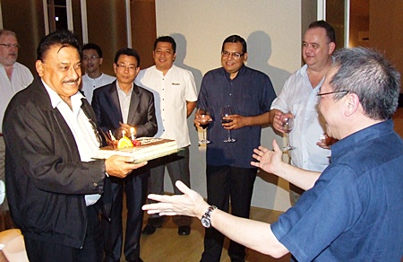 Peter seems moved as Chatchawal Supachayanont, GM Dusit Thani Pattaya and friends wish him a happy birthday.