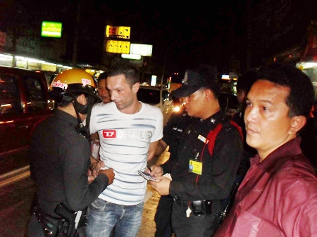 Sebastian Guillaume is arrested at a checkpoint on Pratamnak Road in Jomtien Beach.