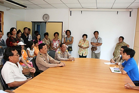 Royal Thai Marines Lt. Col. Pramot Sri-Ondee and angry residents complain to Village Chief Natthachai Sangsri about local water supply problems. 