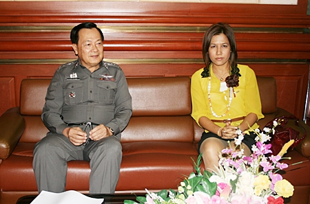 Pol. Col. Yongyuth Khondok, left, meets with an official from the Chonburi Social Development and Human Security Department, right, during the workshop held March 7.