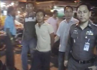 Nattawut Kongpet is detained by police following his arrest on Naklua and Sukhumvit roads.