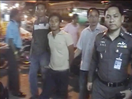 Nattawut Kongpet is detained by police following his arrest on Naklua and Sukhumvit roads.