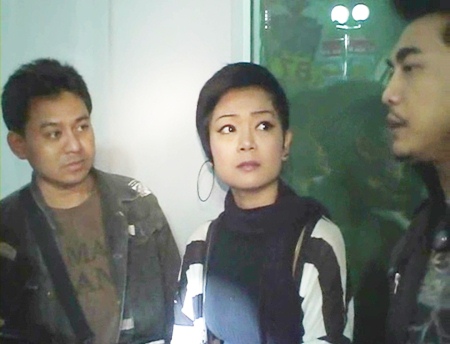 Janthima Limsawat, center, is taken into custody on human trafficking charges.