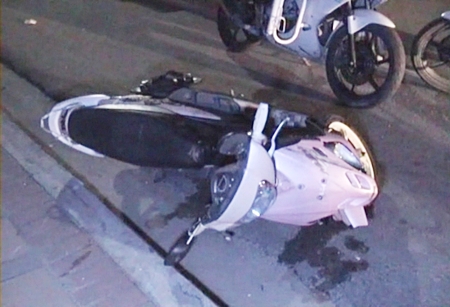 The police officer’s motorcycle lies on the ground following the crash.