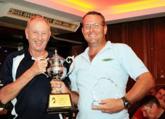 Lewiinski’s Golf Manager, Colin Davis, left, presents the Club Championship trophy to Dayle Hoek.