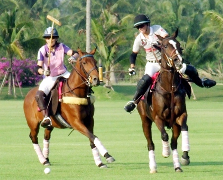 Thai Polo and St. Regis battle for possession of the ball at the Queen’s Cup Pink Polo event held at Thai Polo Club in Pattaya, Saturday, February 19. 