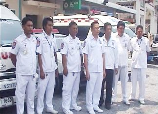Volunteers listen intensely to briefing