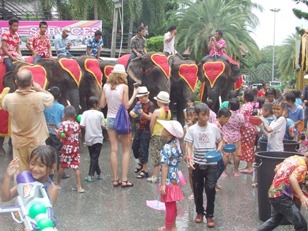 Let the fun begin.  Those little squirt guns, no matter how big they seem, are no match for an elephant’s trunk.